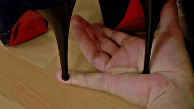 Painful hand and finger trampling with high heels